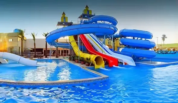 Commercial water park and swimming pool construction project with custom water slides designed by Swimwell